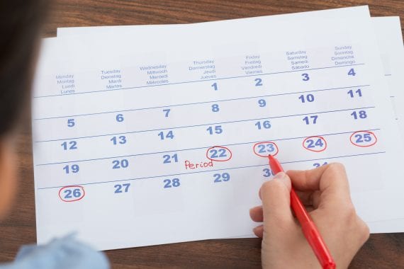 Close-up,Of,Person,Marking,Menses,Date,On,Calendar